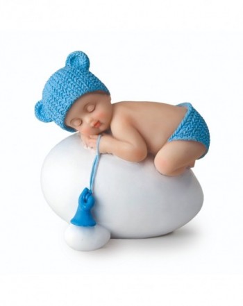 Figura niño bebé azul durmiendo sobre huevo